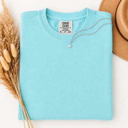 Comfort Colors® 1717 — Folded with Props mockup in Lagoon Blue