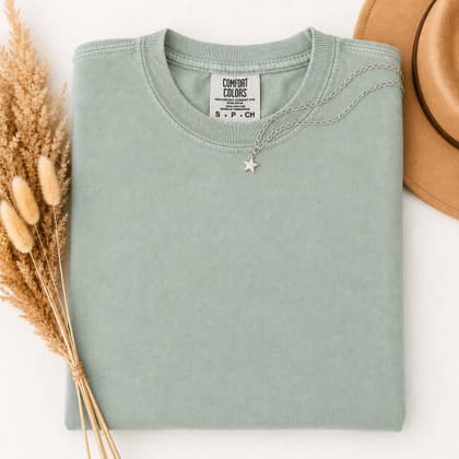 Comfort Colors® 1717 — Folded with Props mockup in Bay