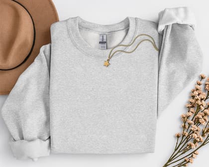 Gildan 18000 Sweatshirt — Folded with Props mockup in Ash