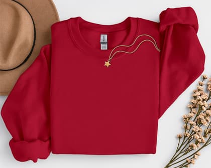 Gildan 18000 Sweatshirt — Folded with Props mockup in Cardinal Red