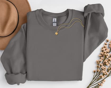 Gildan 18000 Sweatshirt — Folded with Props mockup in Charcoal