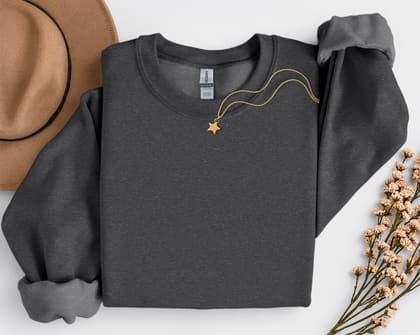 Gildan 18000 Sweatshirt — Folded with Props mockup in Dark Heather