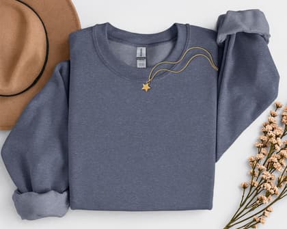 Gildan 18000 Sweatshirt — Folded with Props mockup in Heather Sport Dark Navy