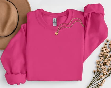 Gildan 18000 Sweatshirt — Folded with Props mockup in Heliconia