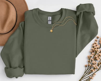 Gildan 18000 Sweatshirt — Folded with Props mockup in Military Green