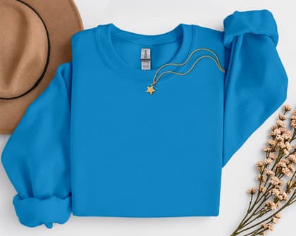 Gildan 18000 Sweatshirt — Folded with Props mockup in Sapphire