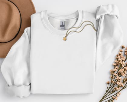 Gildan 18000 Sweatshirt — Folded with Props mockup in White